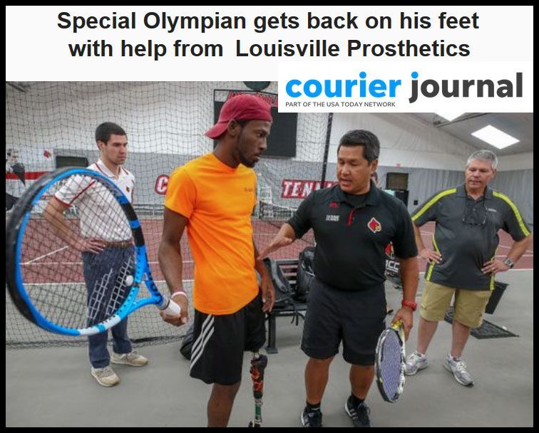 Special Olympian with prosthetic leg receives tennis instruction from coach in a court.