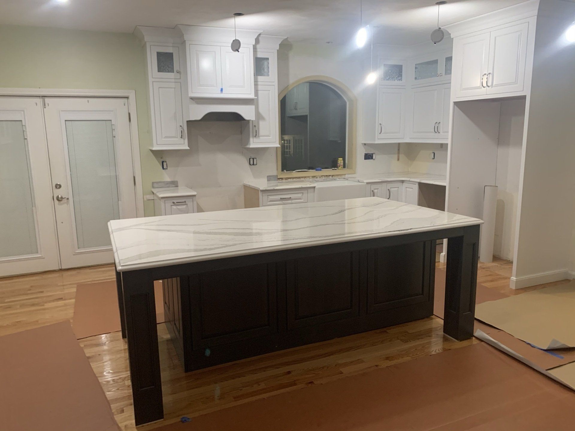 A kitchen with a large island in the middle of it.