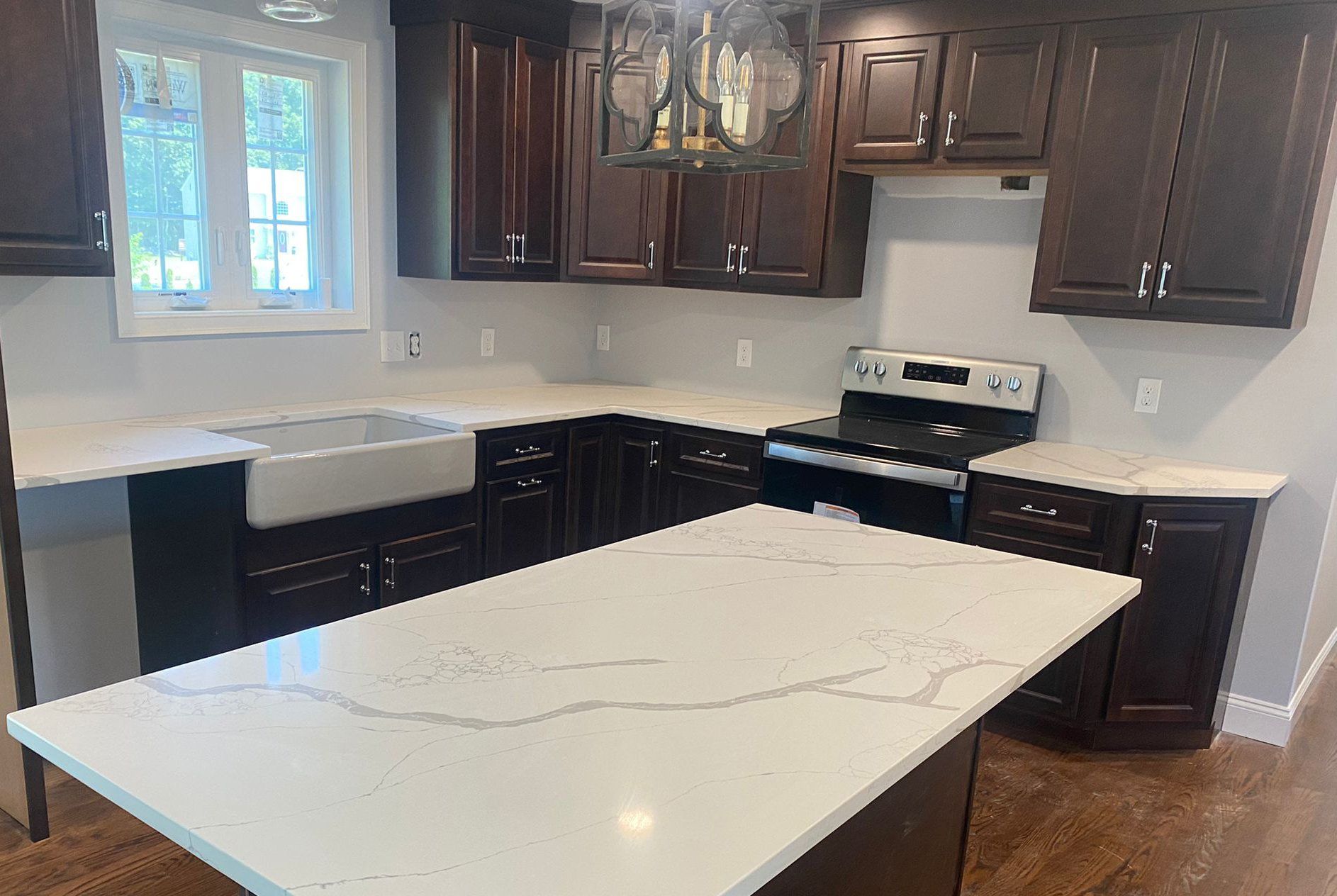 There is a large island in the middle of the kitchen.