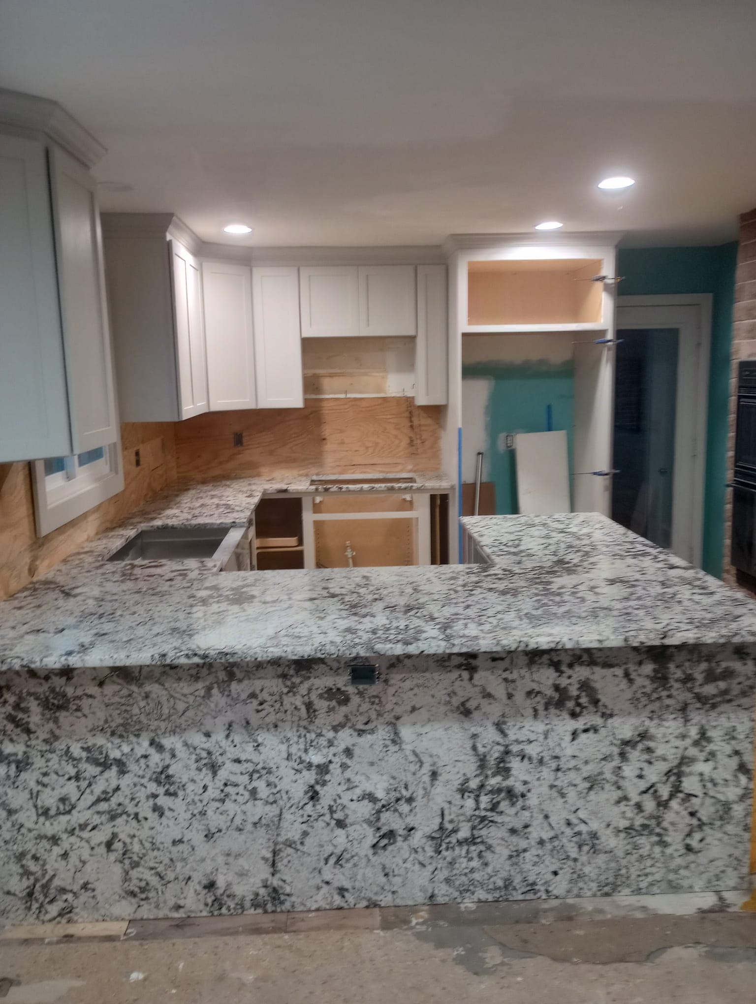 Gray and white u-shaped granite kitchen countertop