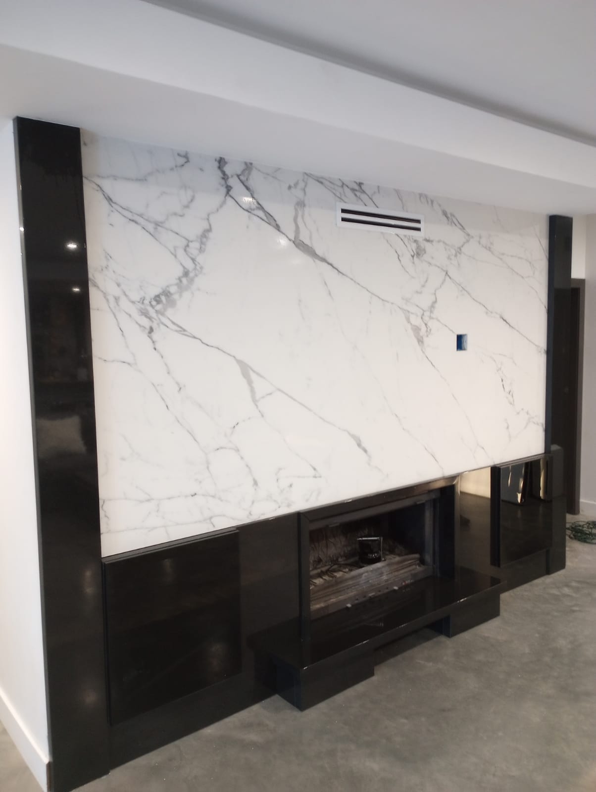 White and gray quartz fireplace surround