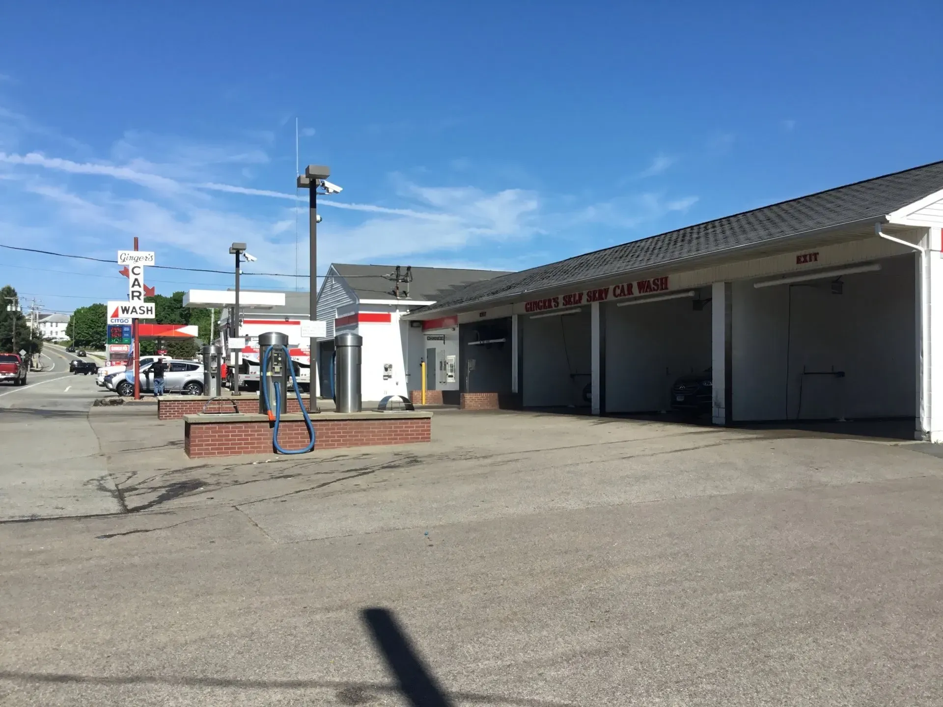 There is a gas station in the background and a car wash in the foreground.
