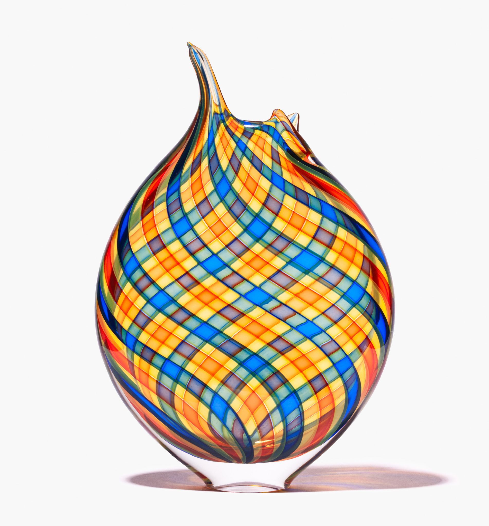 Colorful patterned teardrop-shaped glass ornament with a curved top, isolated on white background