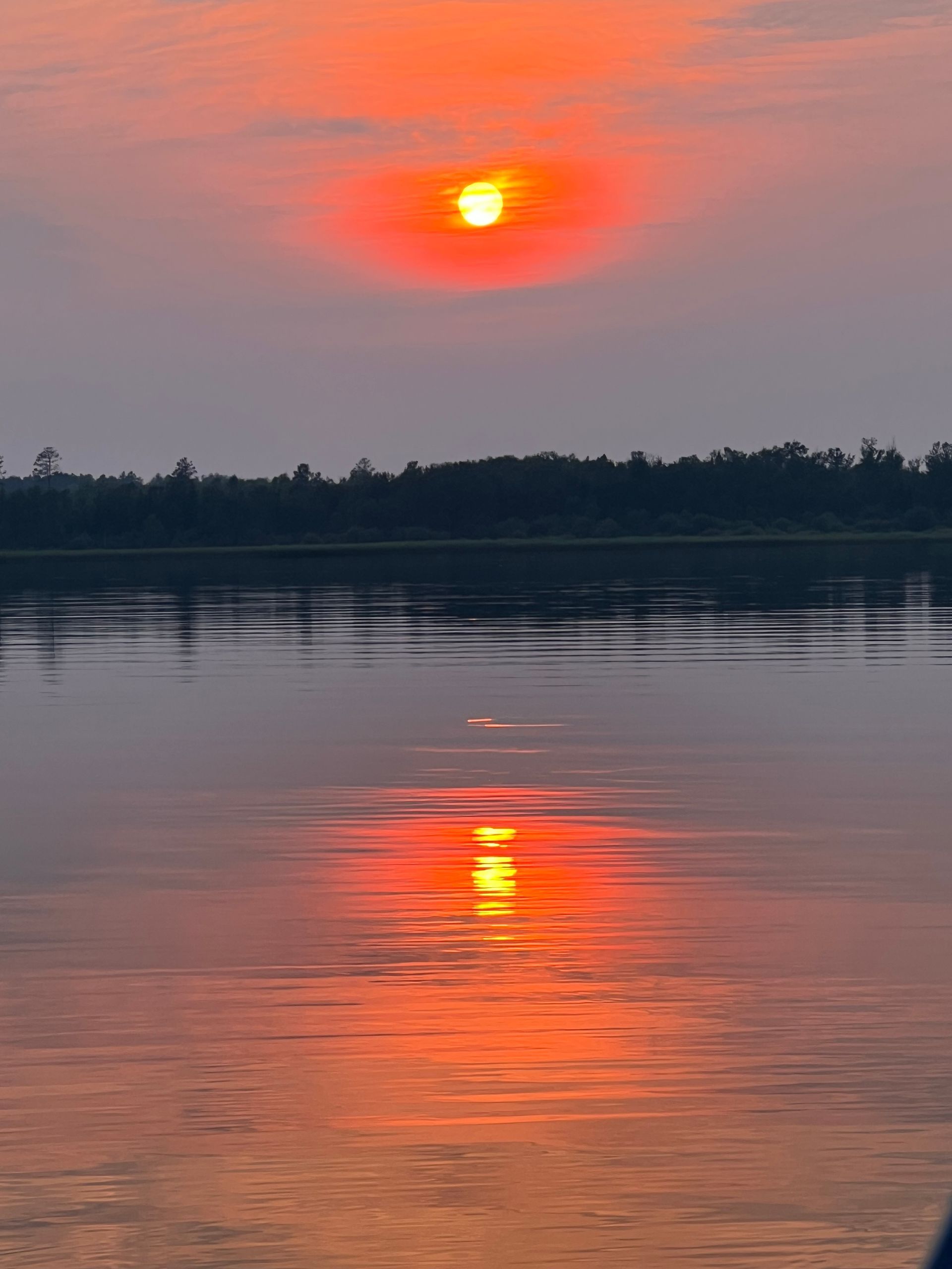 The sun is setting over a body of water