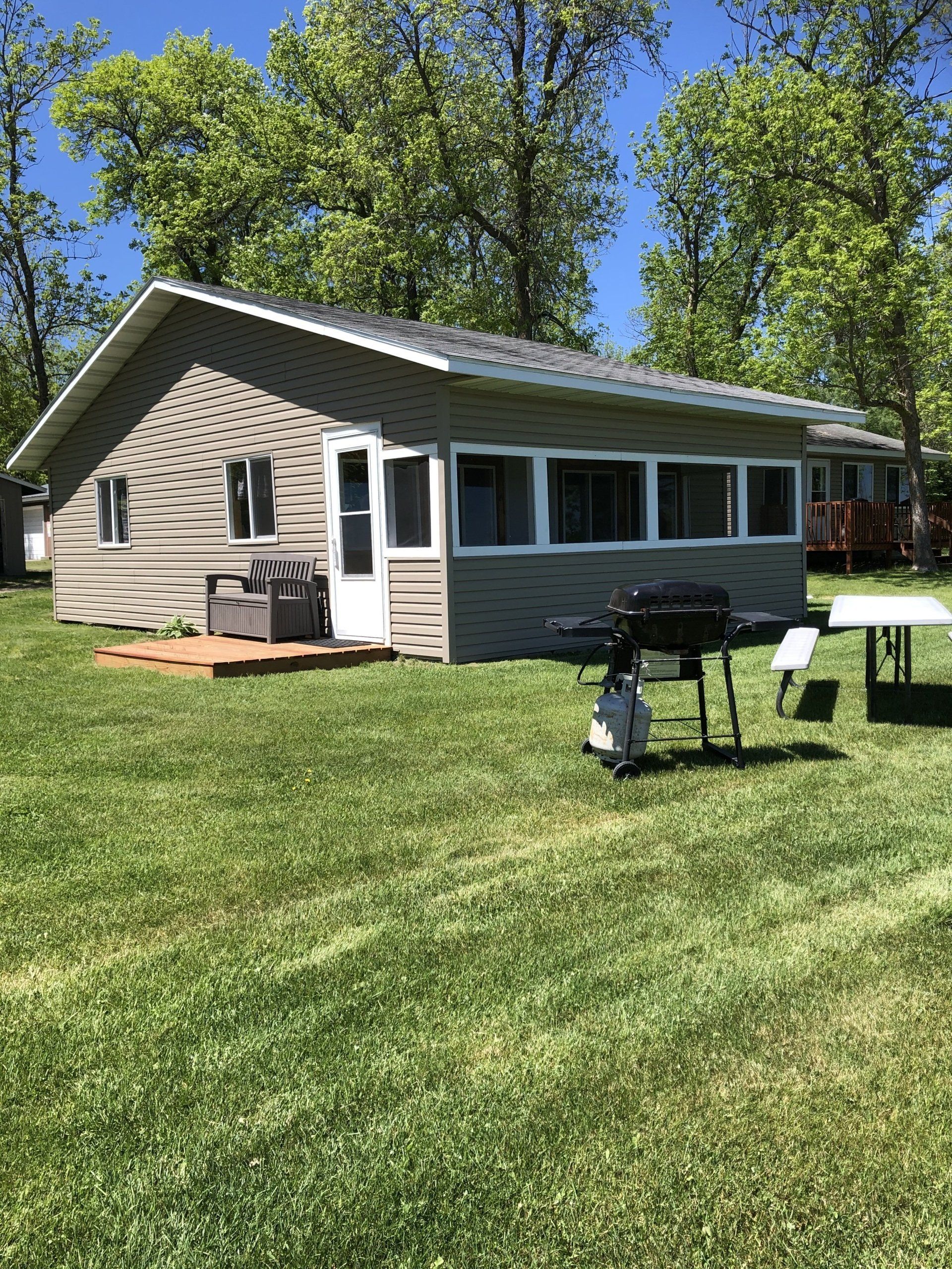 Wooden cabin with spacious lawn