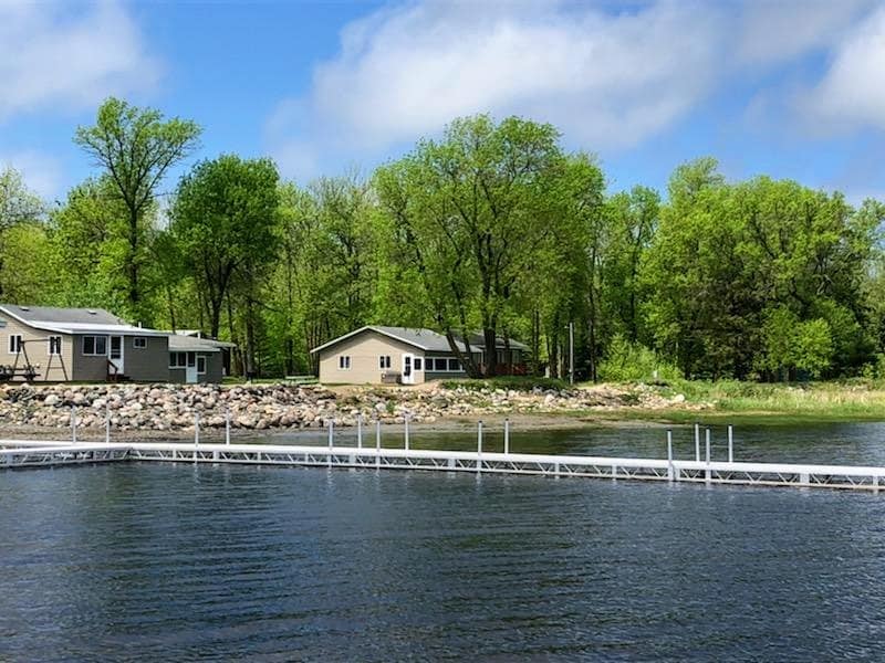 A lake along side with cabin