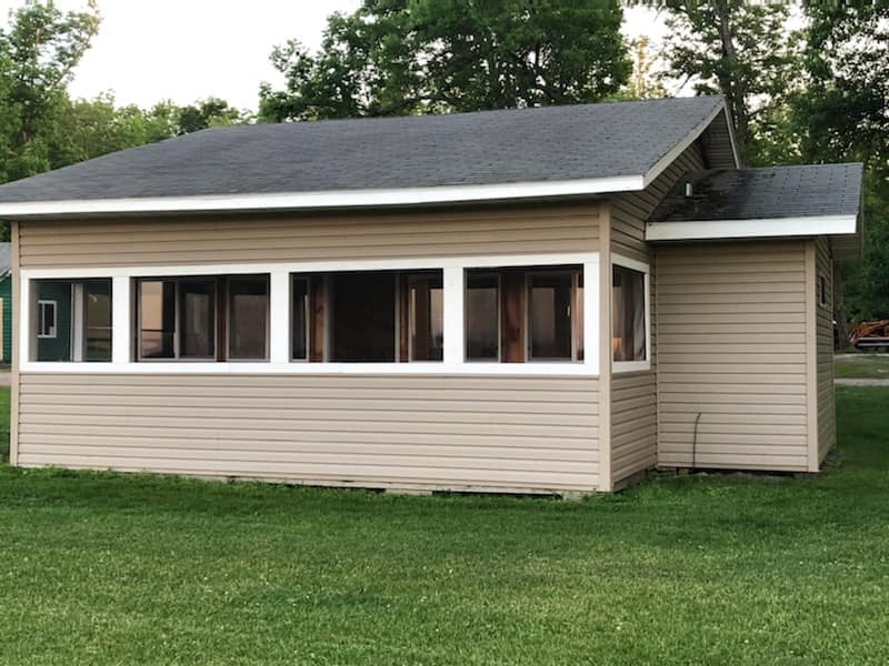 A wooden cabin with windows