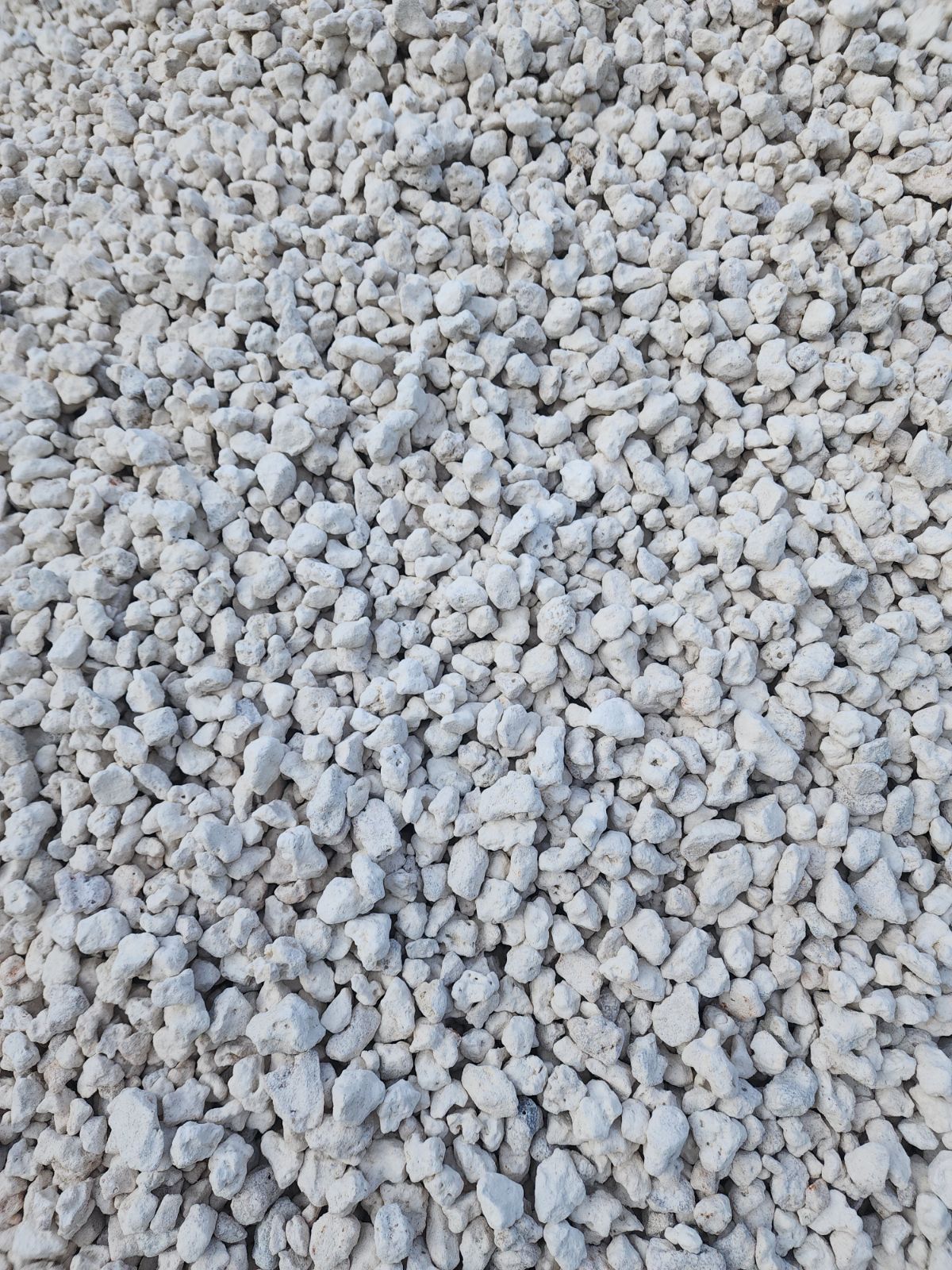 White gravel covering a ground surface.