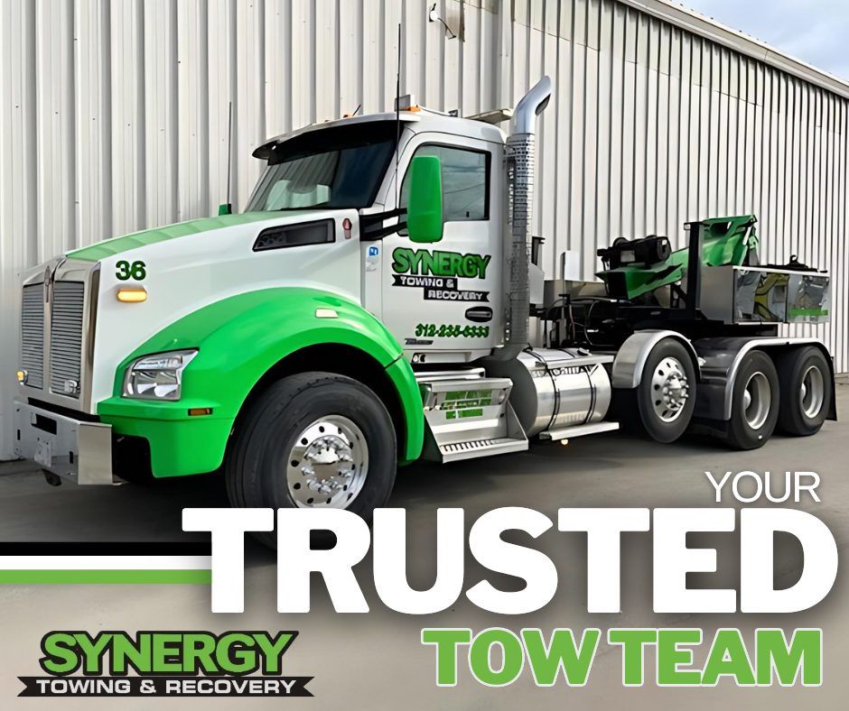 Green and white Synergy Towing truck with 
