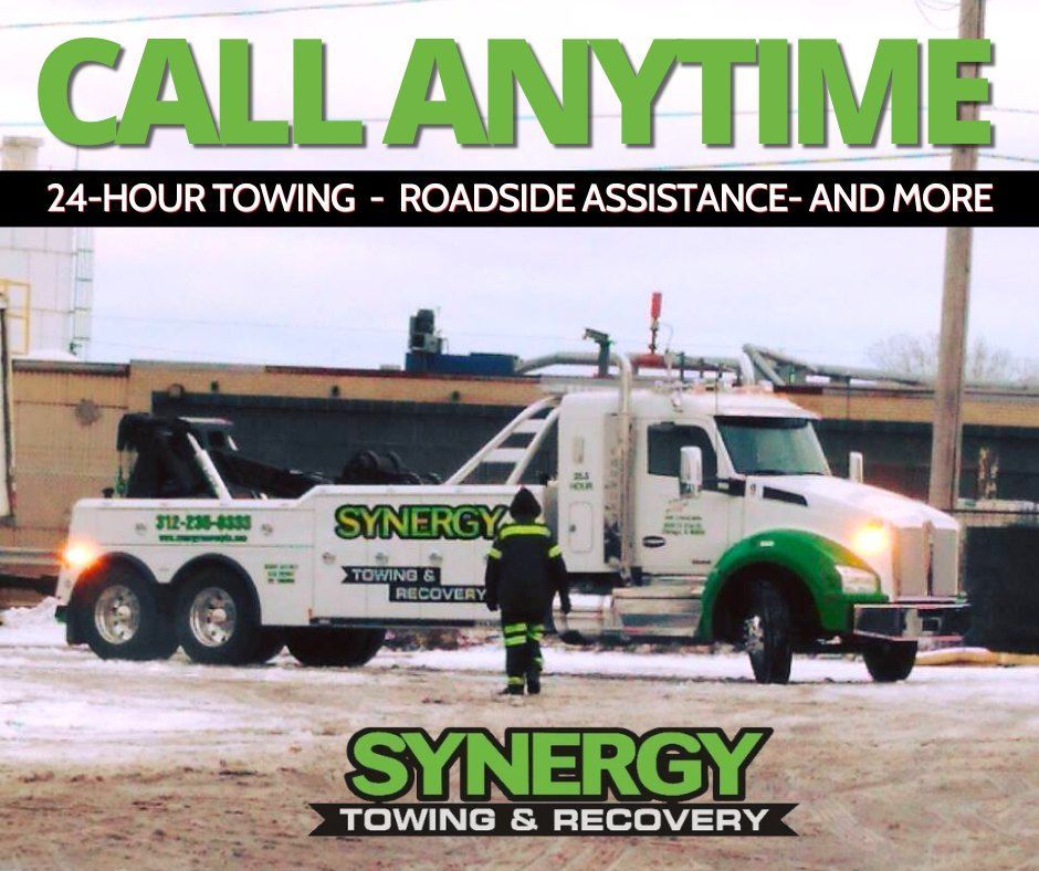 Tow truck with a tow operator, advertisement for 24-hour towing and roadside assistance.