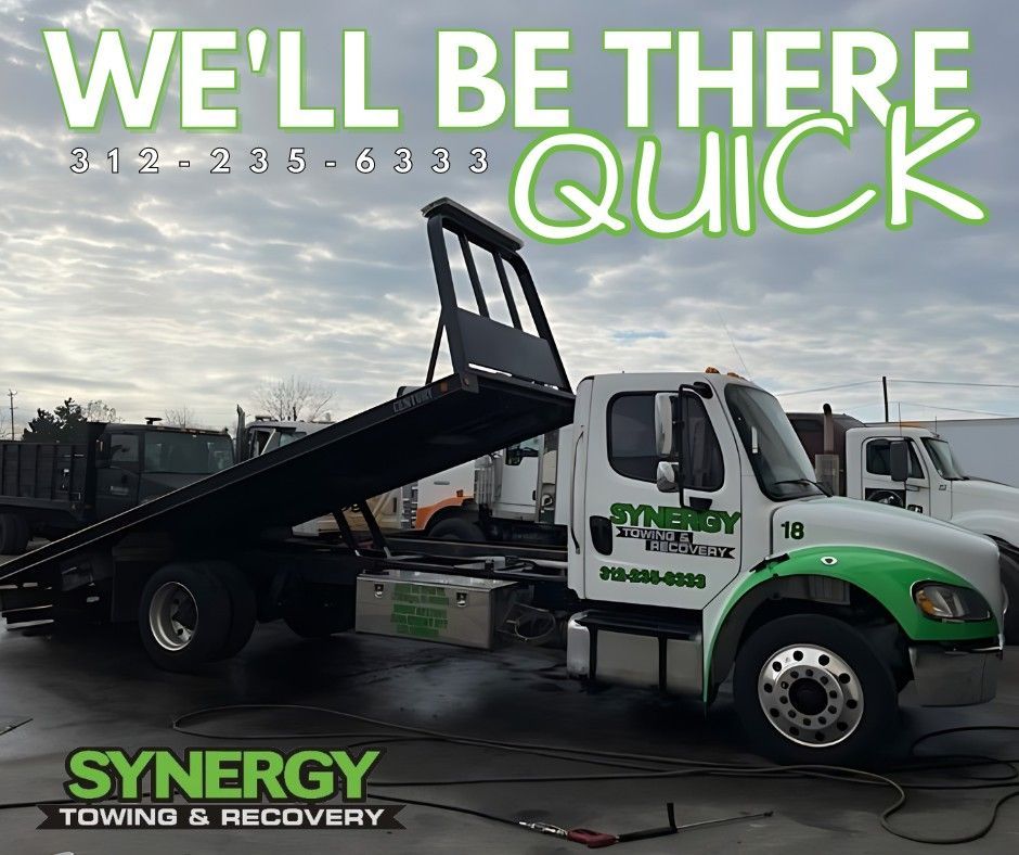 Tow truck with green accents; text reads 