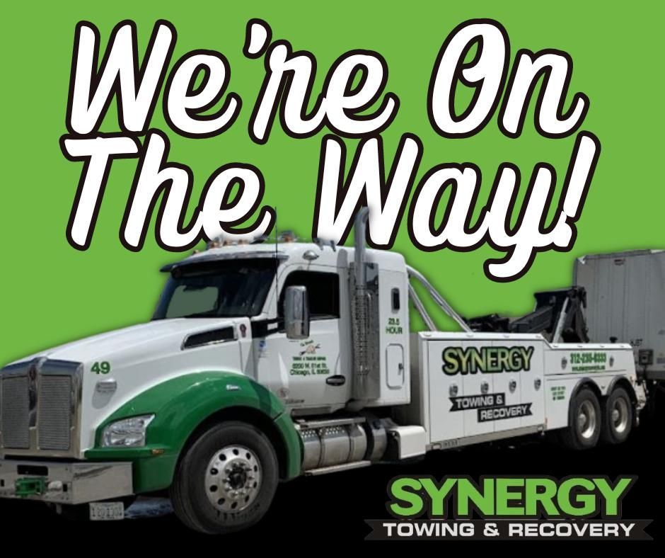 Tow truck with green and white accents, text 