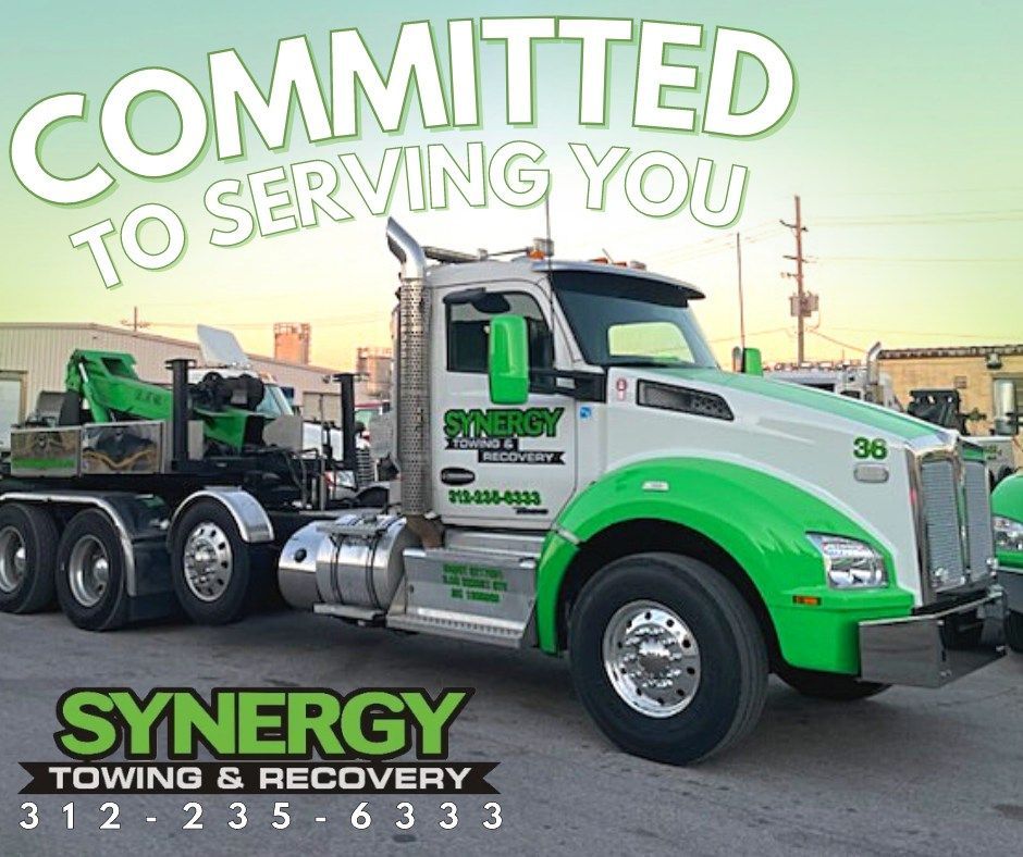 White and green tow truck with 