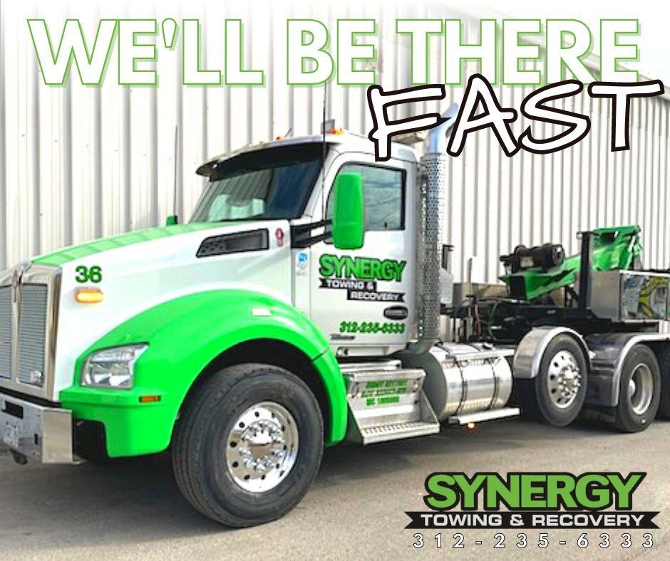 Tow truck with green accents. 