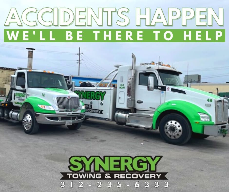 Two white and green Synergy Towing trucks, text reads 