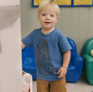 Blond toddler in blue shirt.