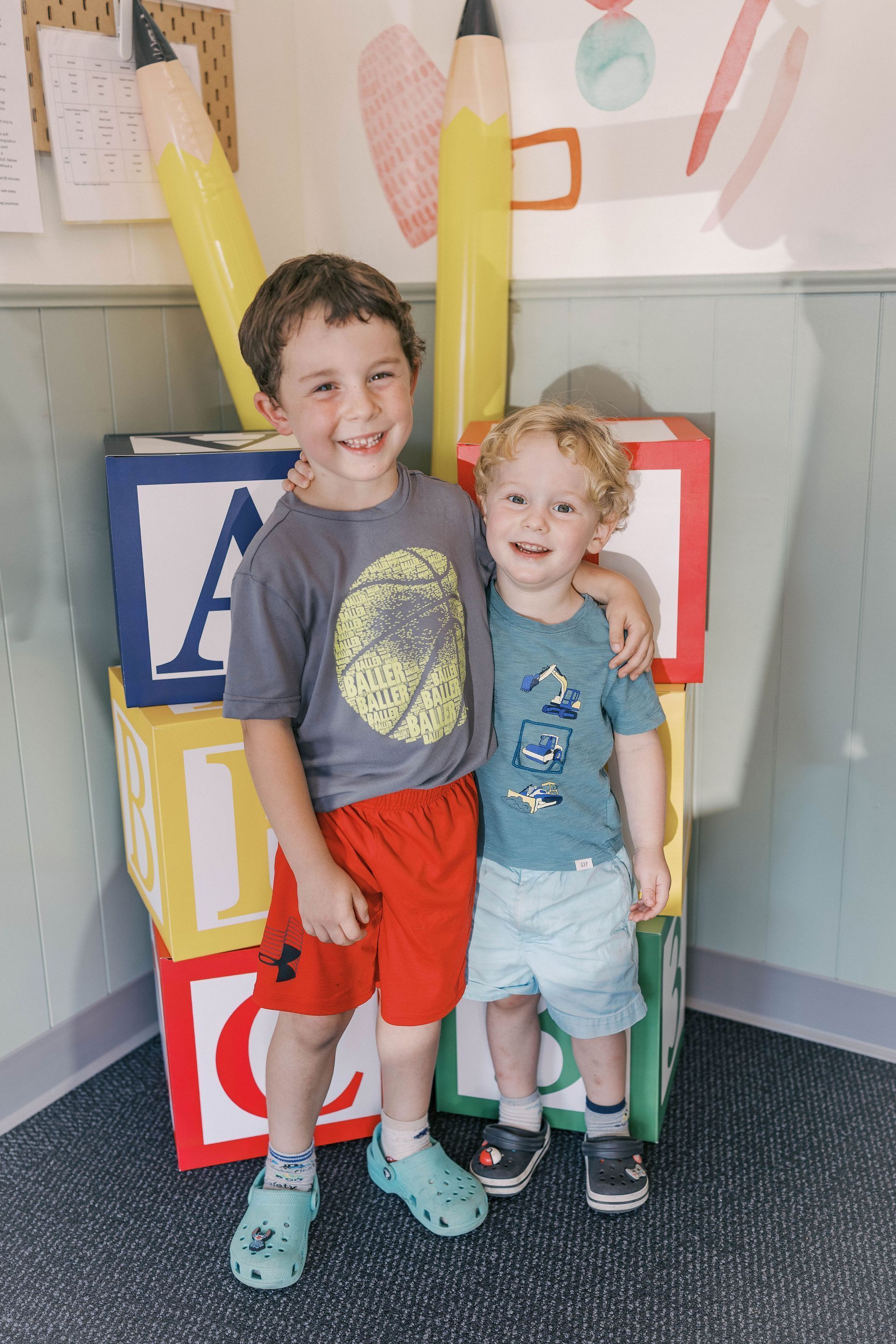 Two young boys smiling.