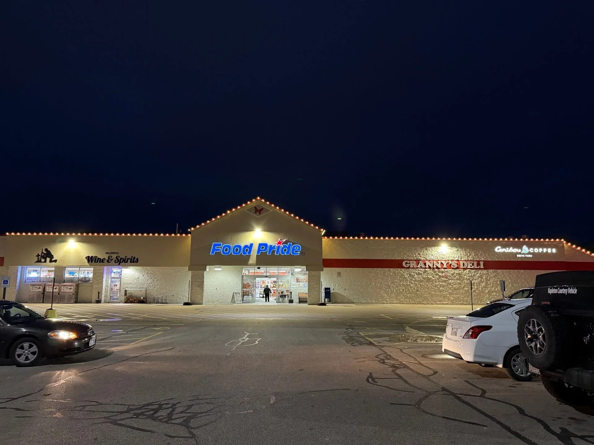 Night exterior of a grocery store, 