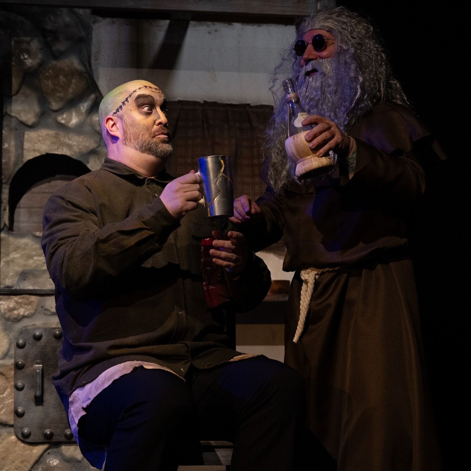 A man with a beard is sitting next to another man with a beard