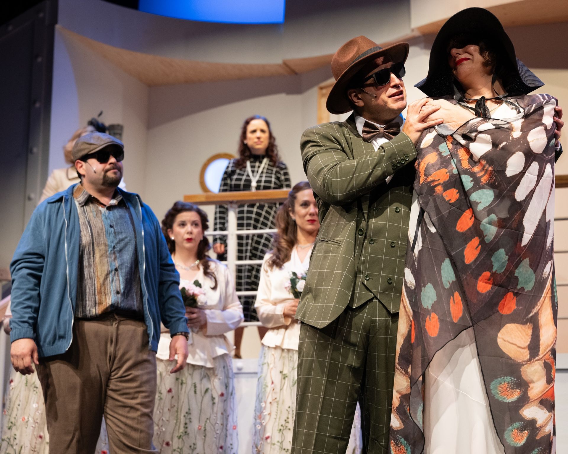 A group of people are standing next to each other on a stage.