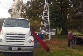 Boom truck lifting a tower