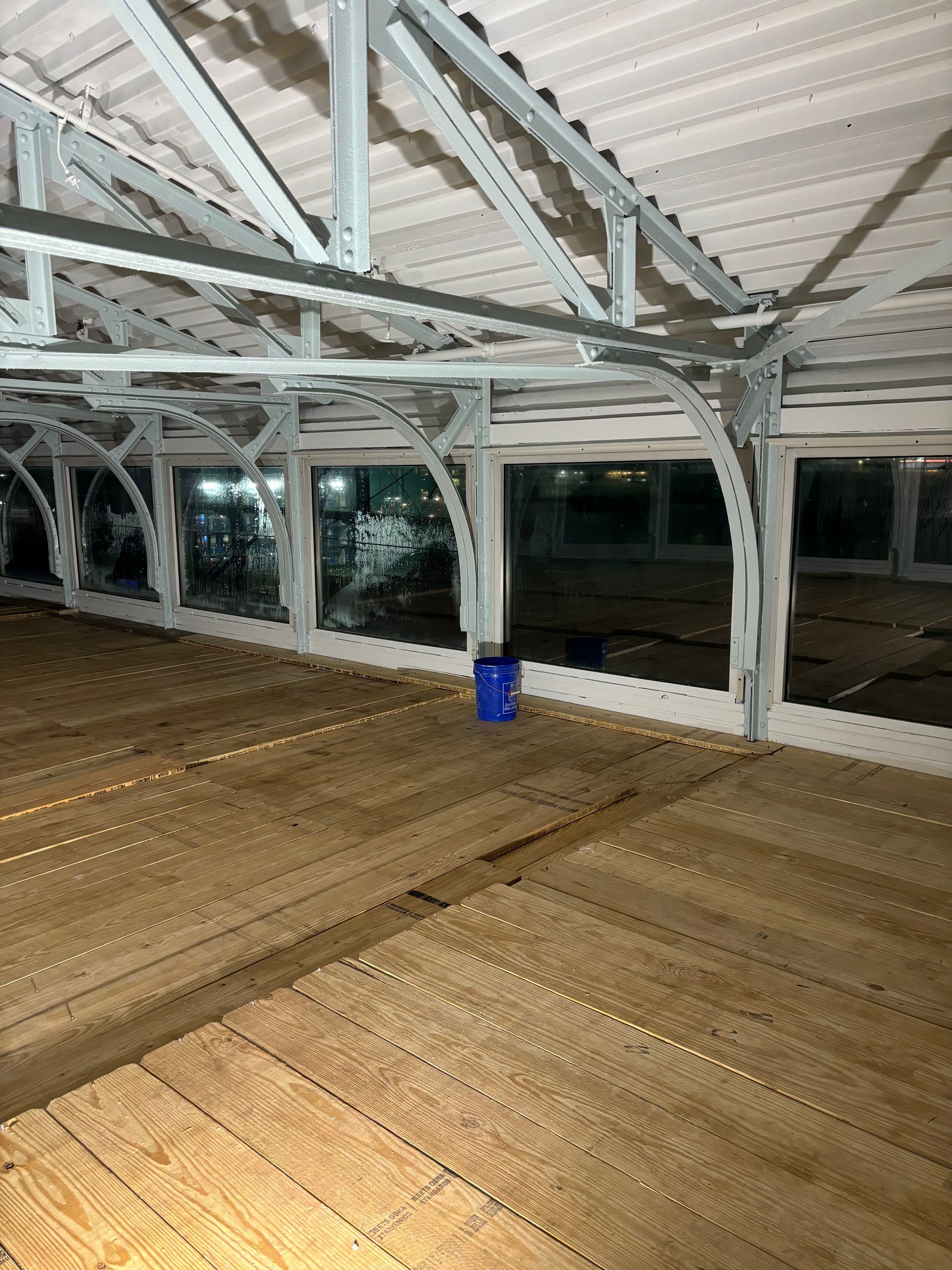 There is a blue bucket in the middle of the room.