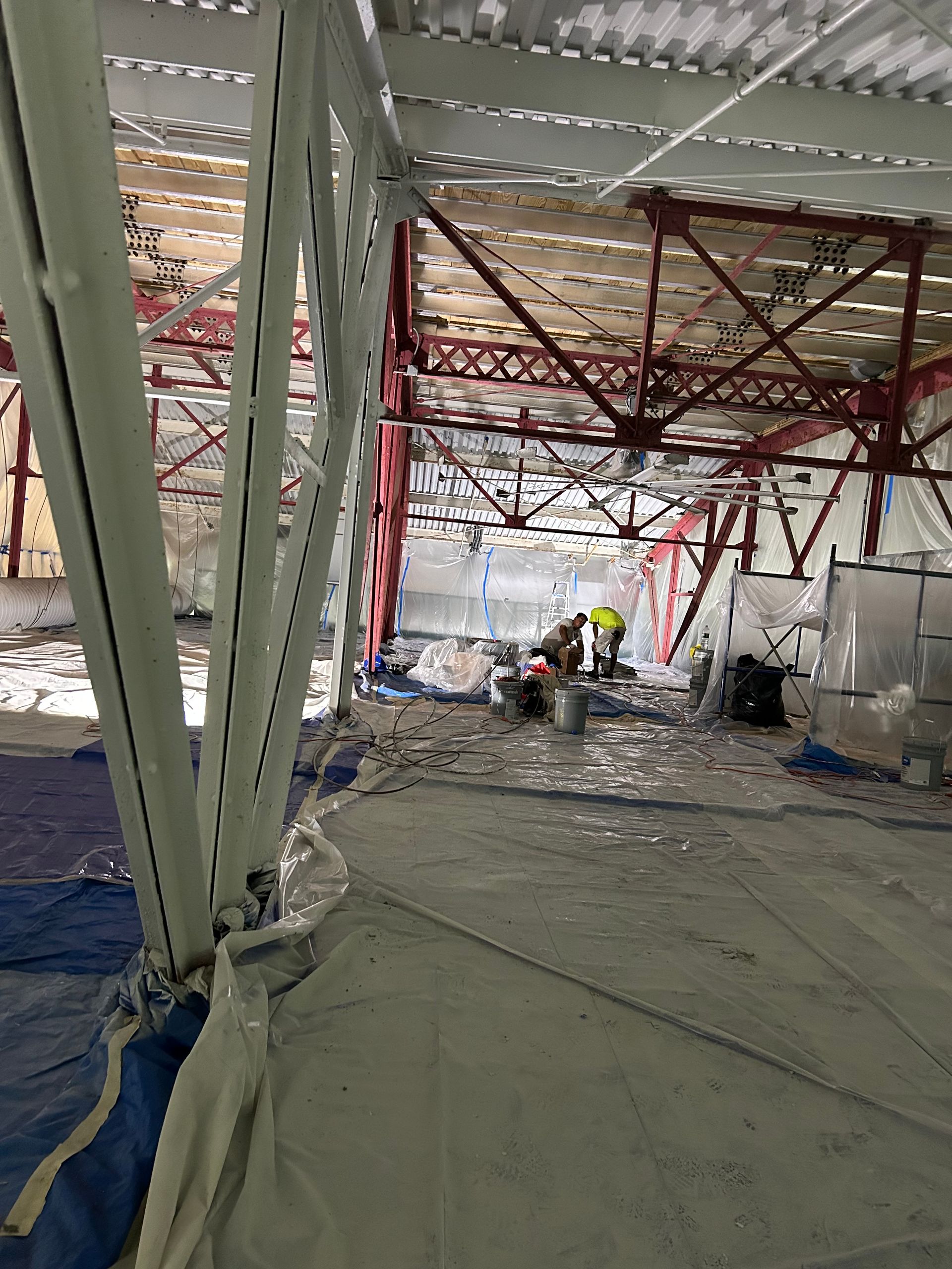 A group of people are working on a building under construction.