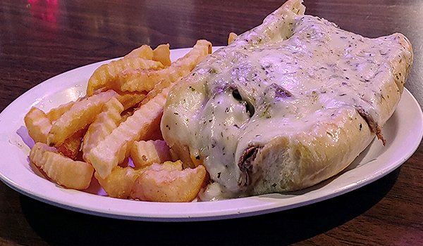 Sandwich and fries on plate