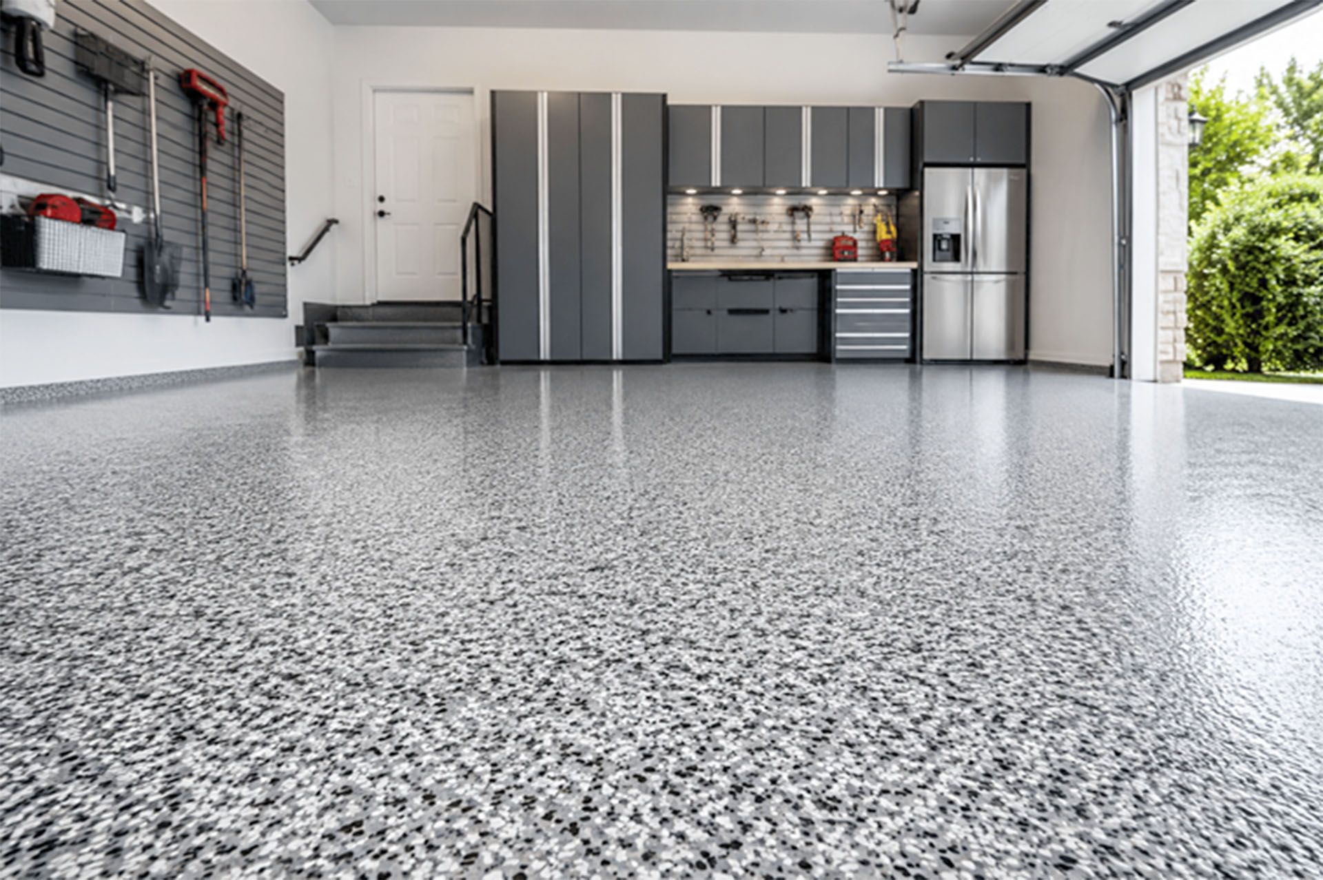 Spacious garage with speckled epoxy floor