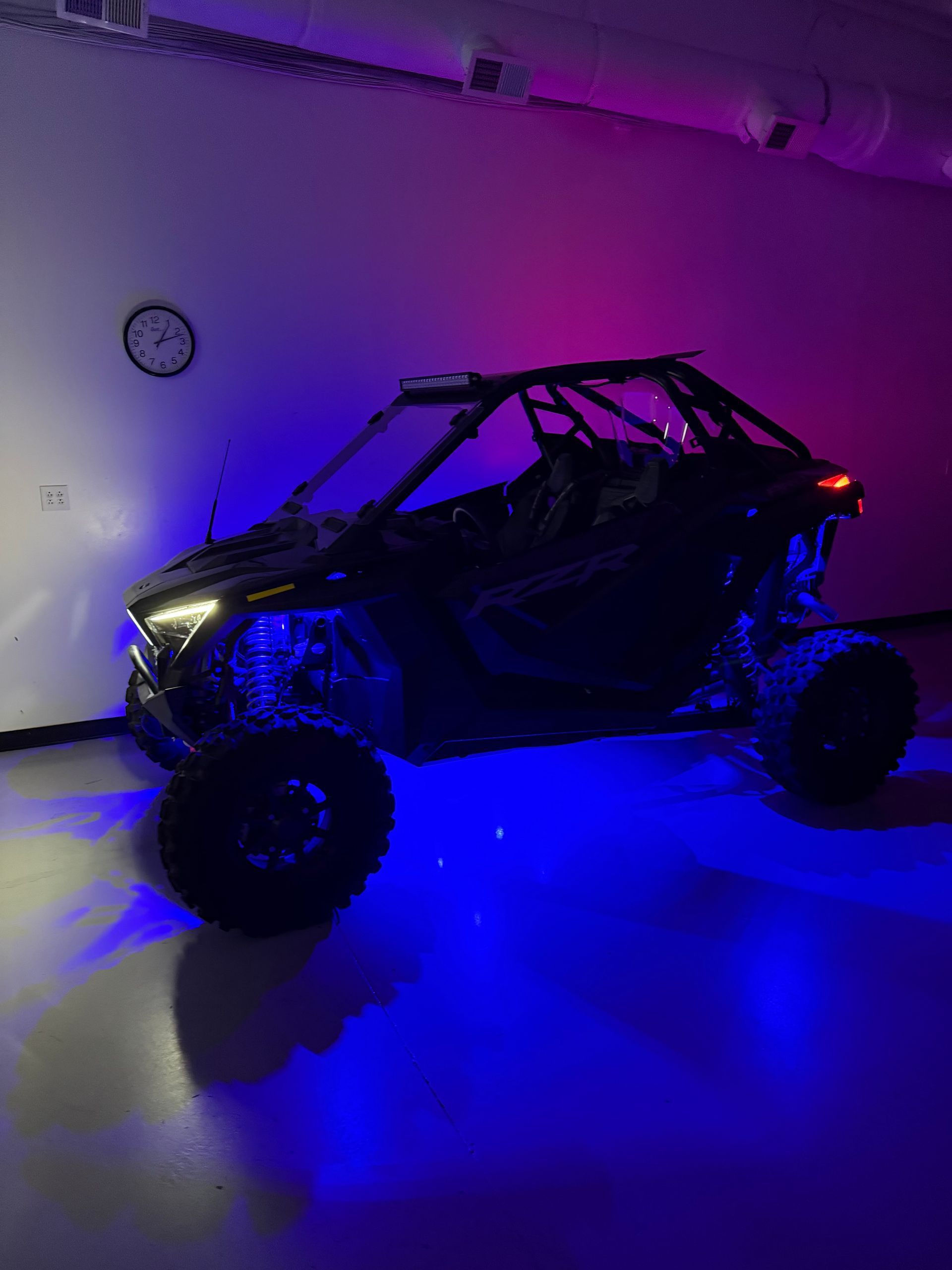 an ATV with blue and purple lights