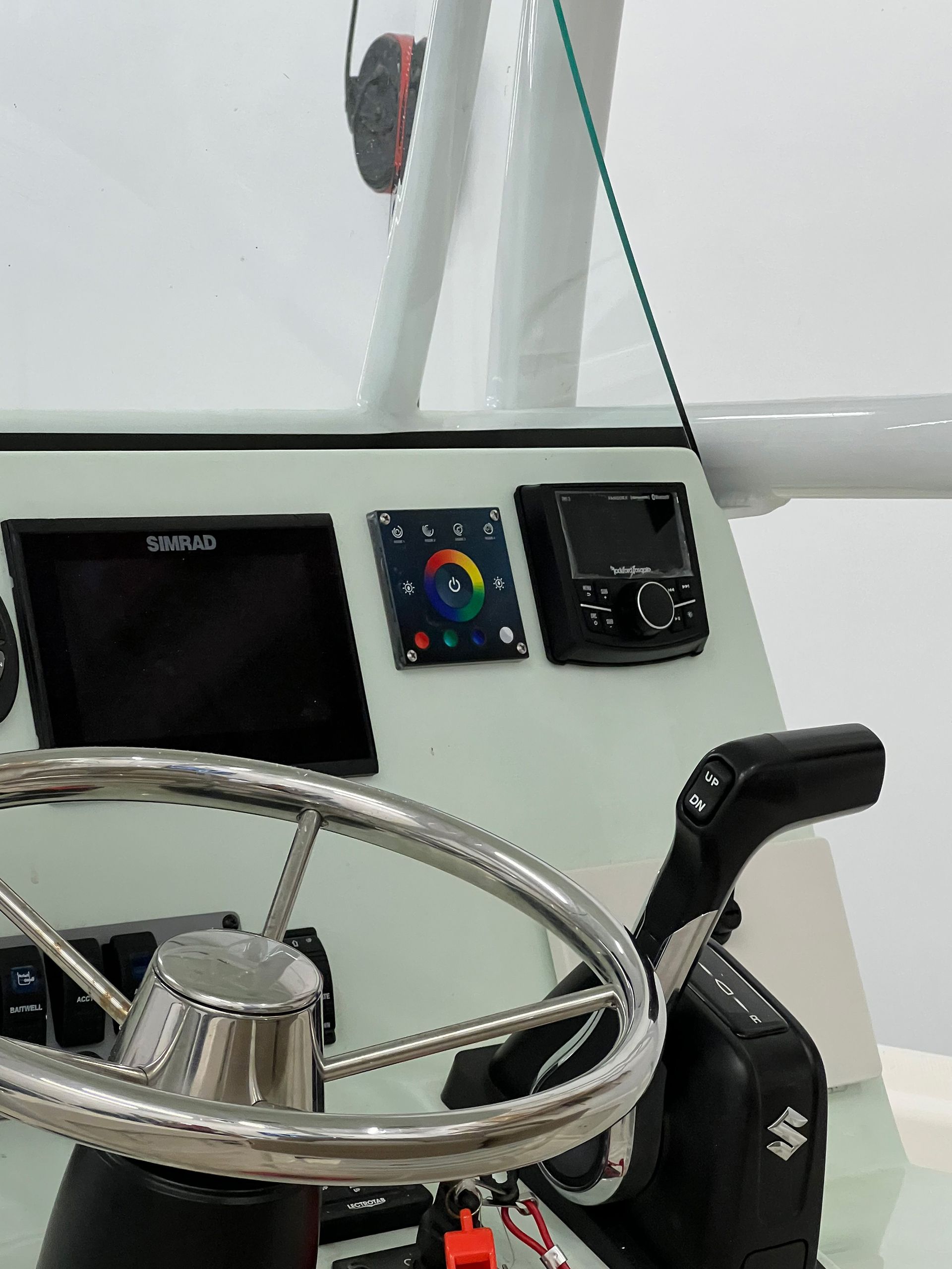 A close up of a steering wheel on a boat