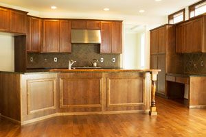 kitchen  with wood texture counter tops and cabinets