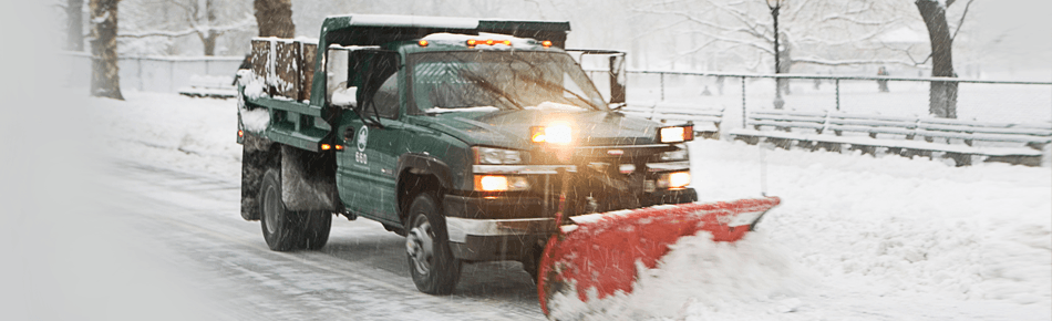 Snowplowing vechile plowing the road