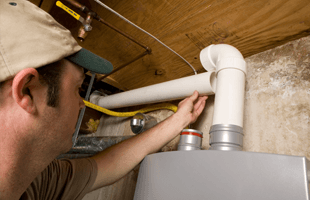 Man serviceing the water heater