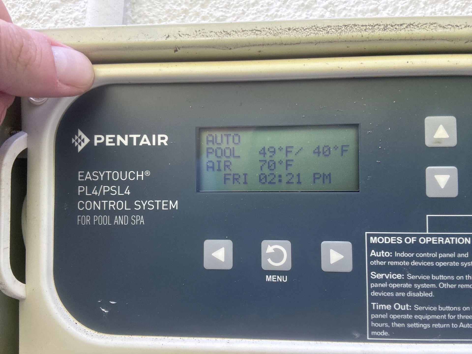 Pentair EasyTouch pool control system display panel showing current air temperature, pool temperature, and time.
