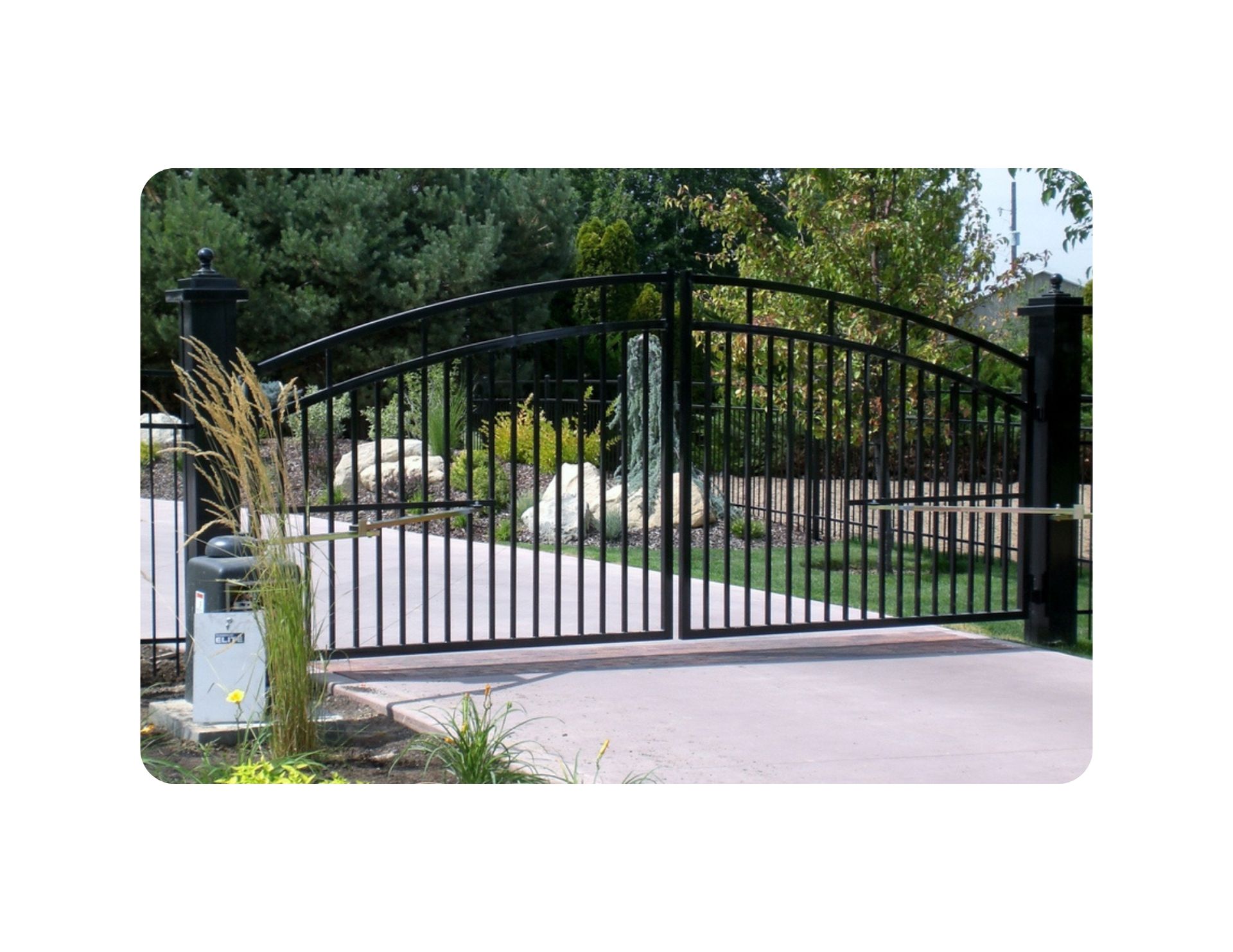 Black metal driveway gate with arched top.
