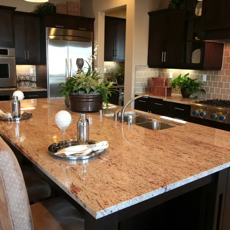 A kitchen with granite counter tops and stainless steel appliances