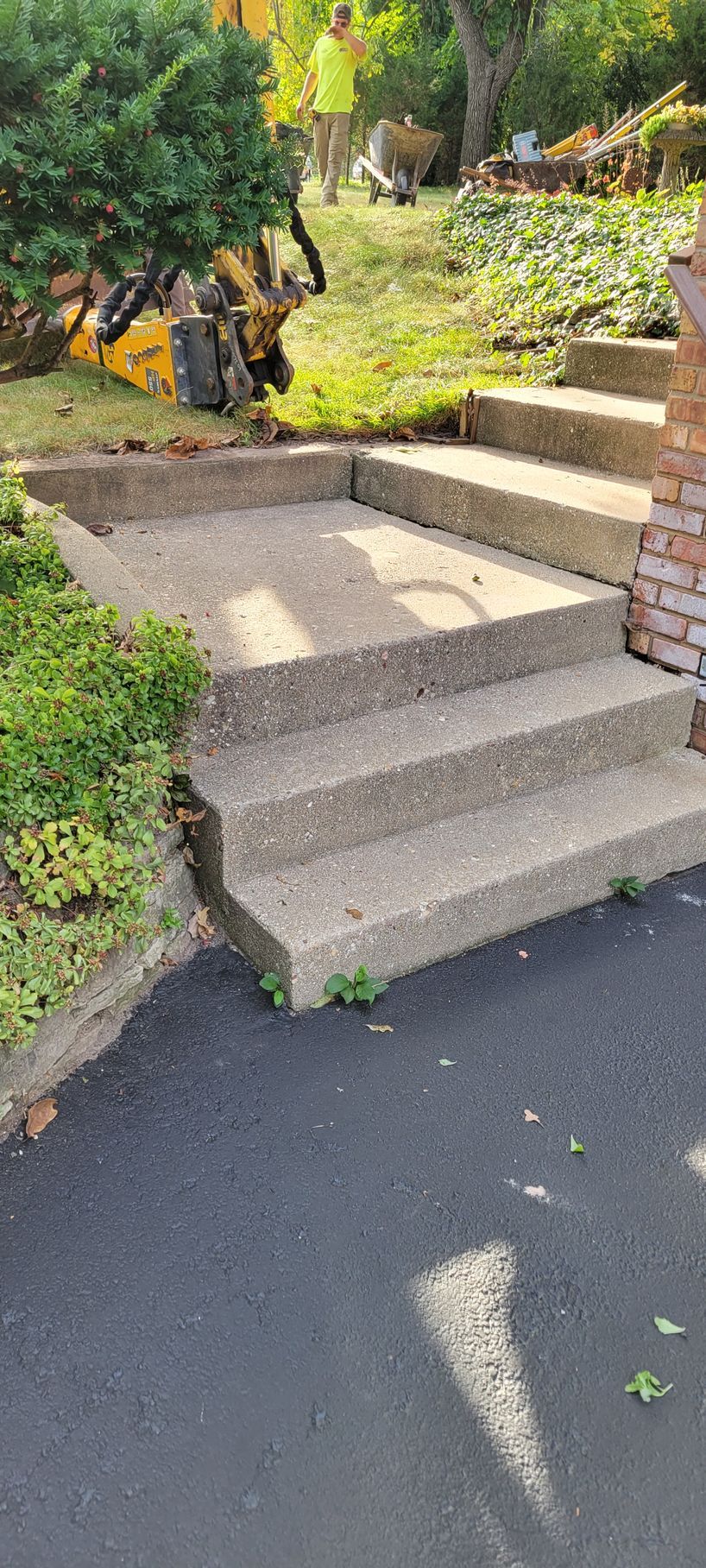 A person is standing next to a set of stairs.