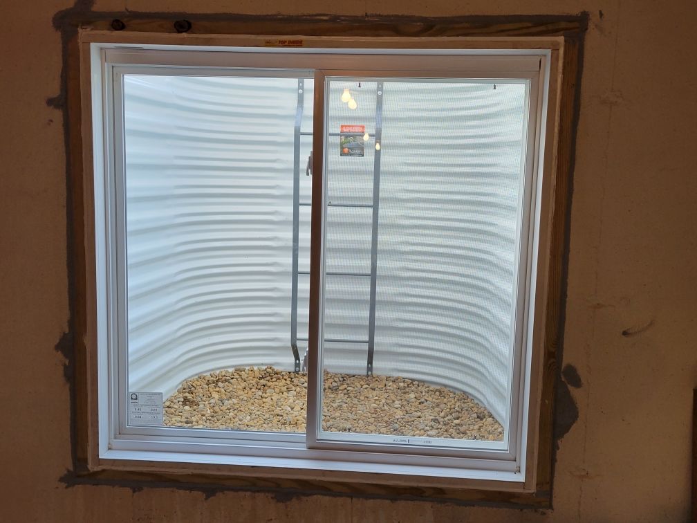 A window in a room with a ladder in it