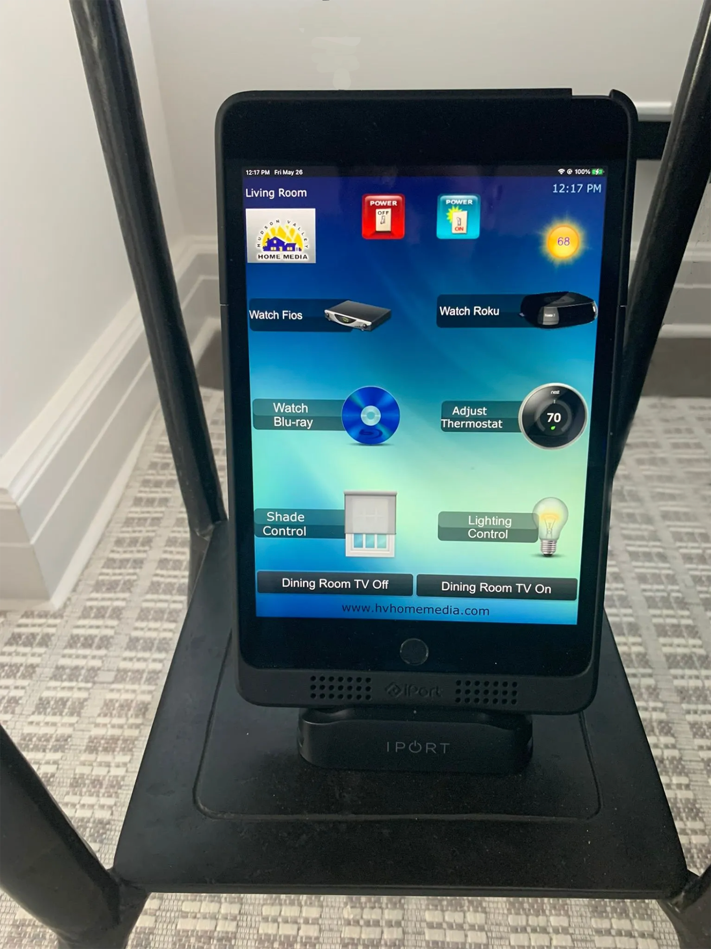 A tablet is sitting on top of a black table.
