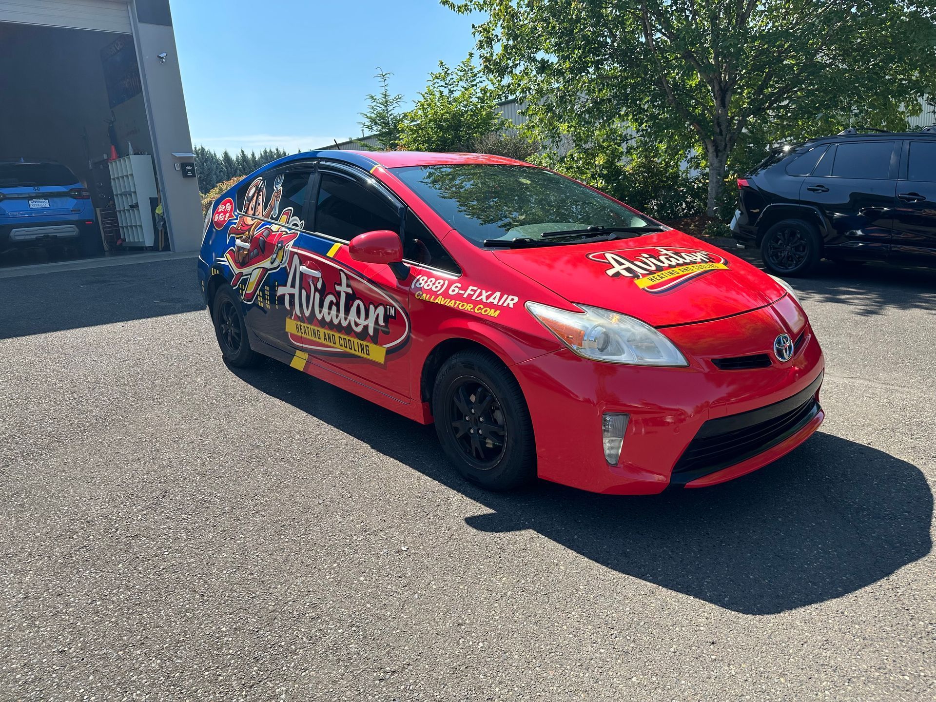 Red Toyota Prius with 