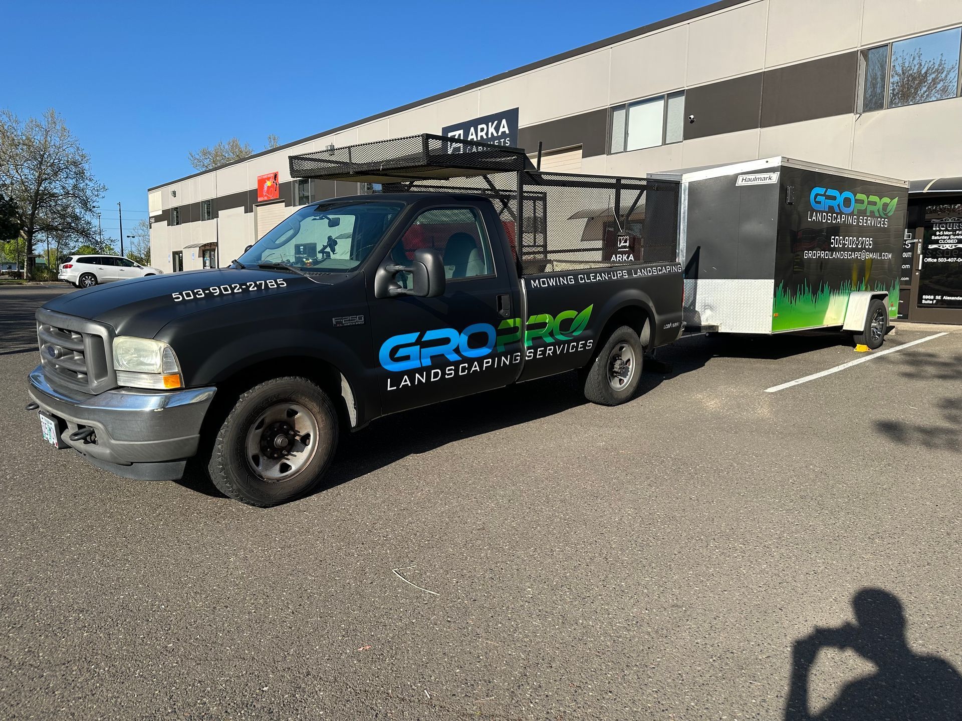 Black pickup truck with trailer, 