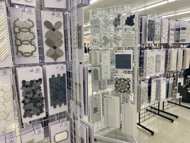 There are many different types of tiles on display in this store.