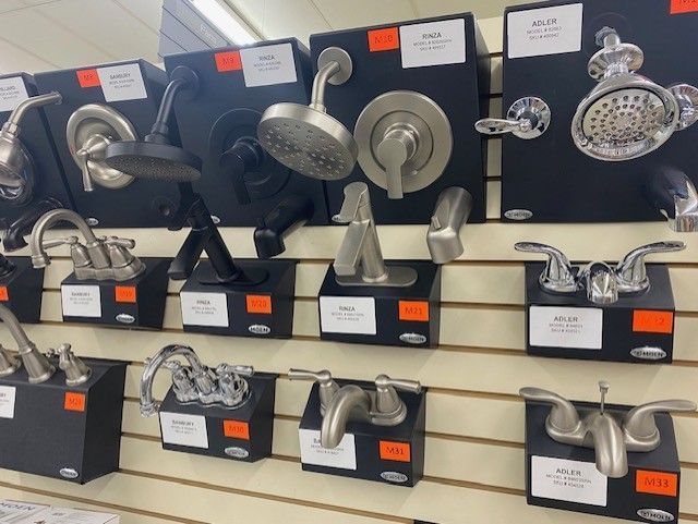 A display of shower heads and faucets in a store