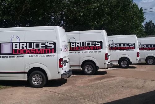 Four white vans with