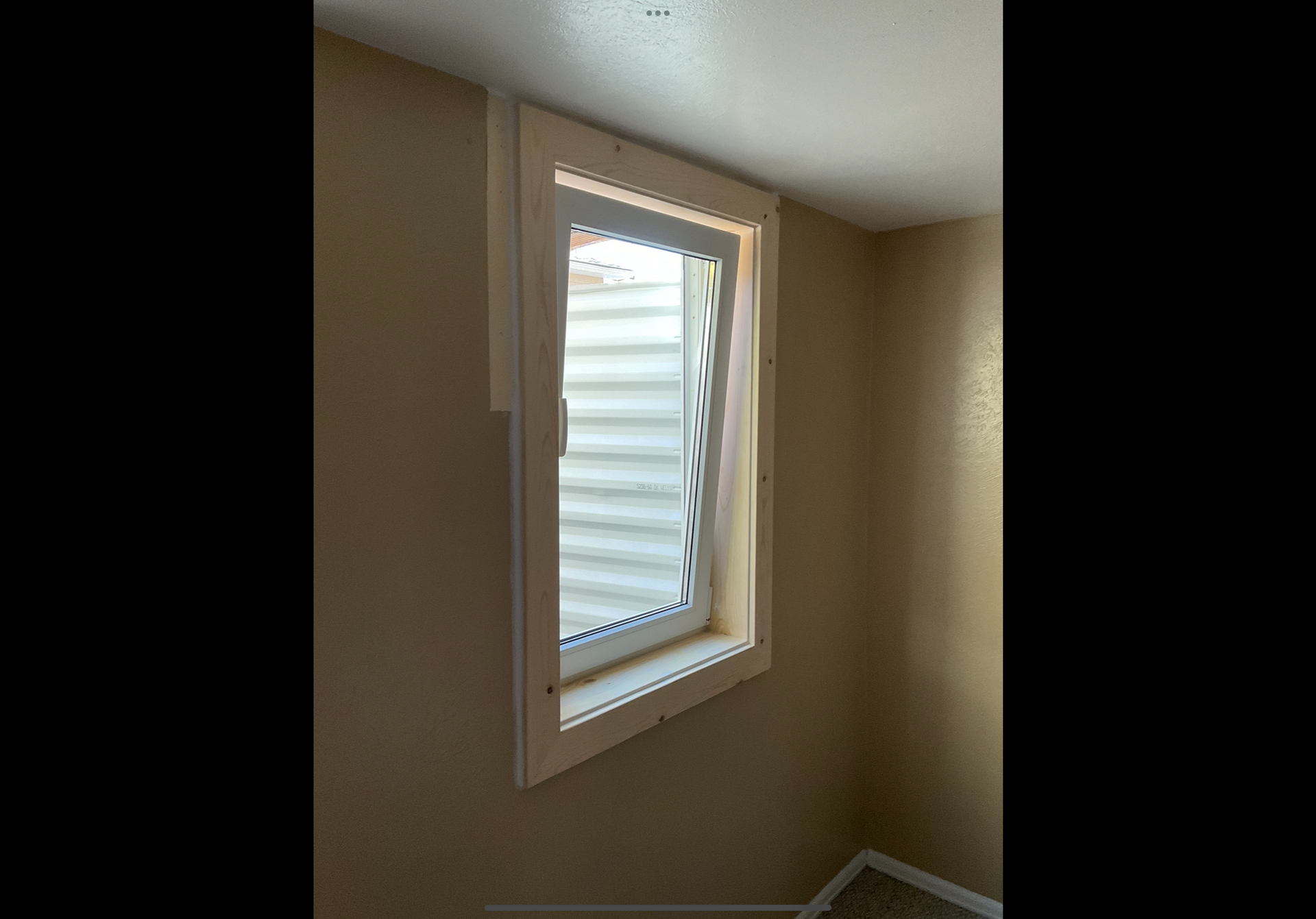 A window with a blue sky behind it