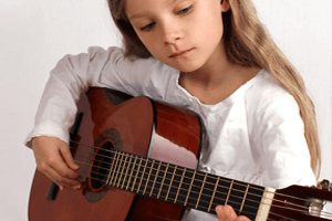 Girl is playing a guitar