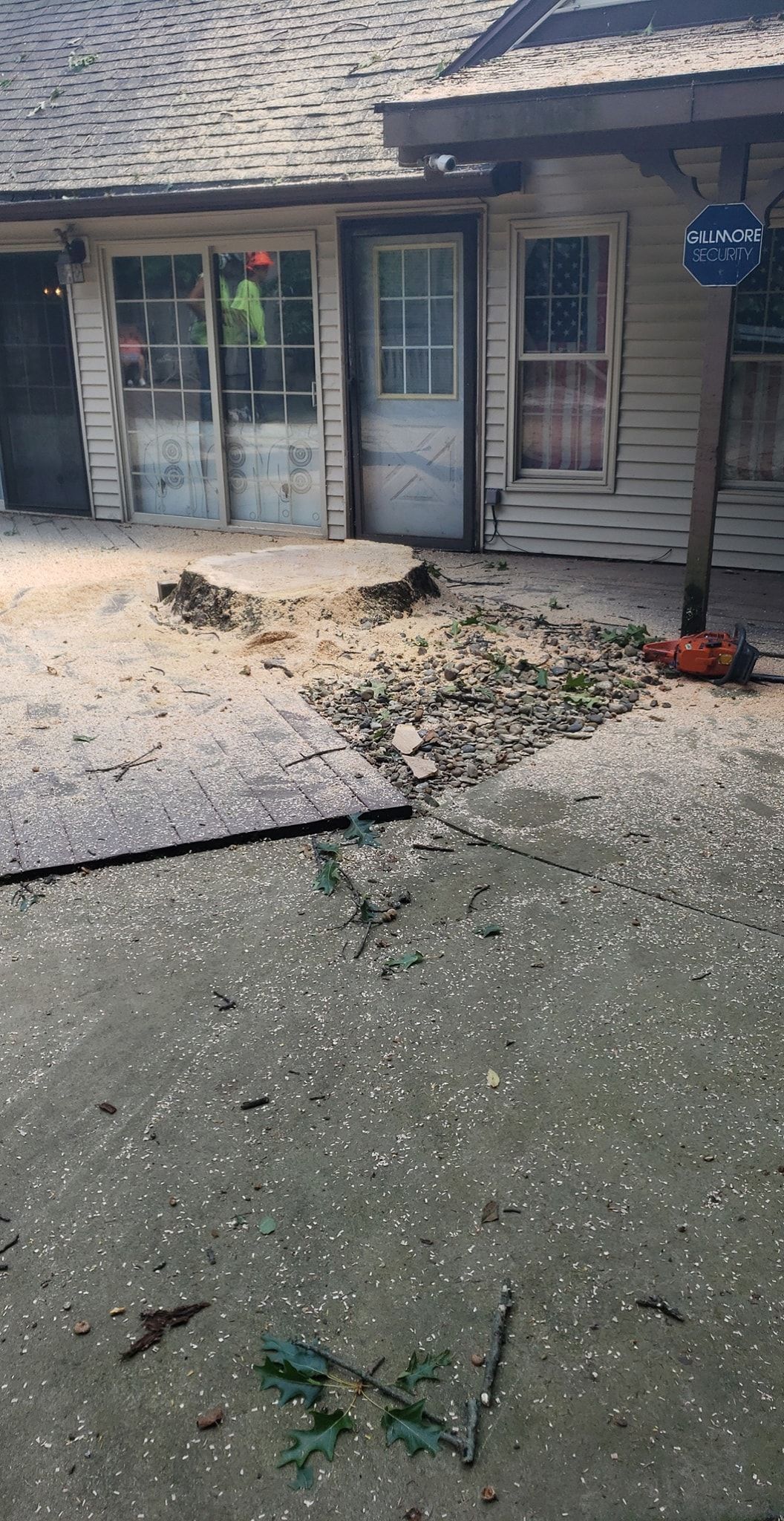 a house with a lot of hail on the ground in front of it