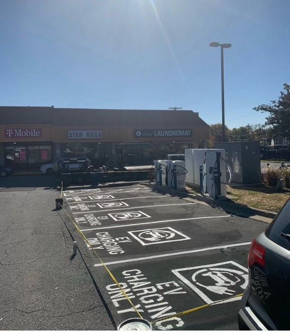 a parking lot with a sign that says electric charging only