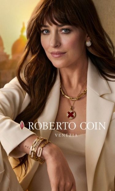 A model in Roberto Coin jewelry, smiling. Venice backdrop, golden accents.